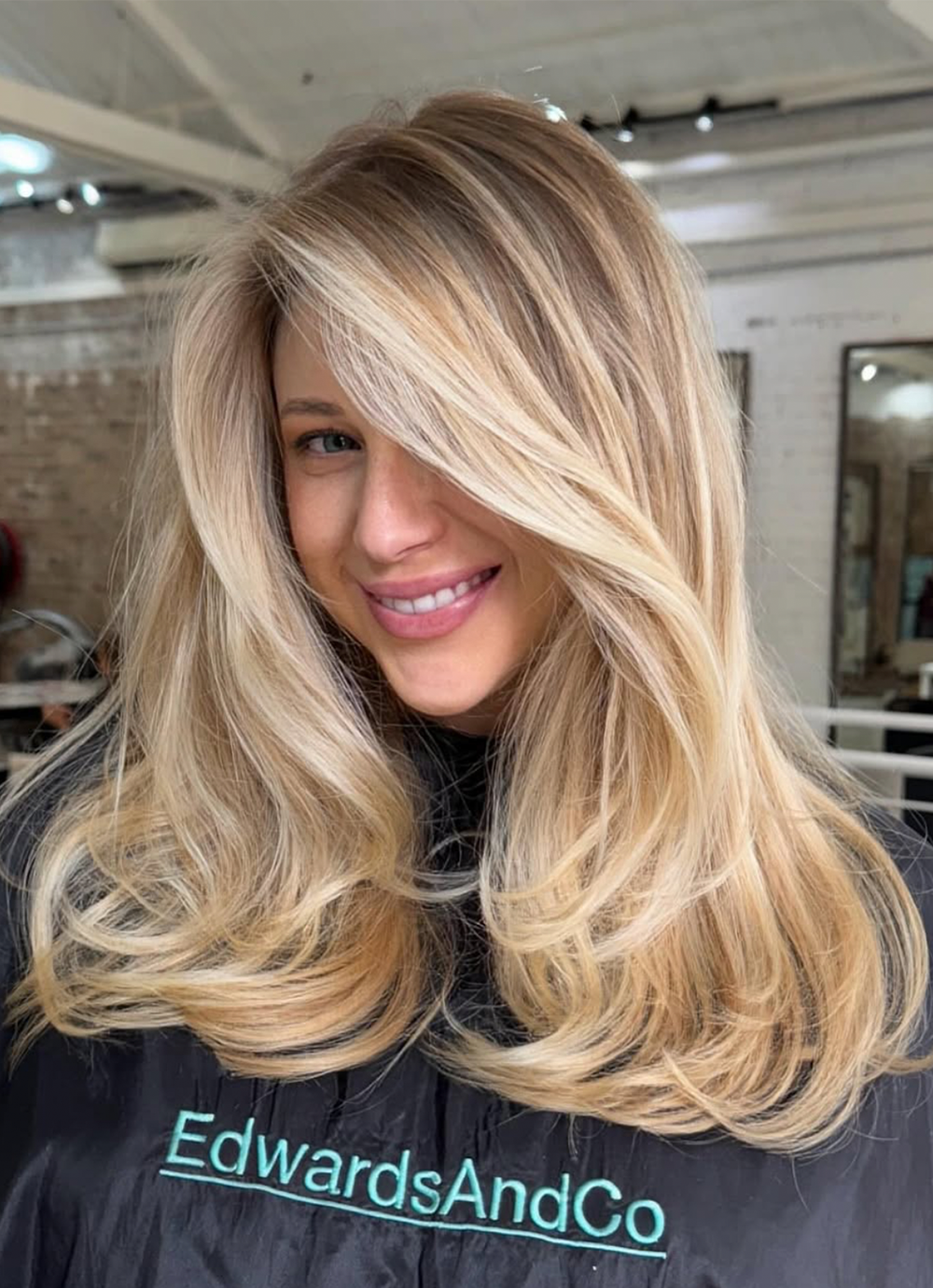 Blonde balayage on long hair by Edwards & Co hair specialists